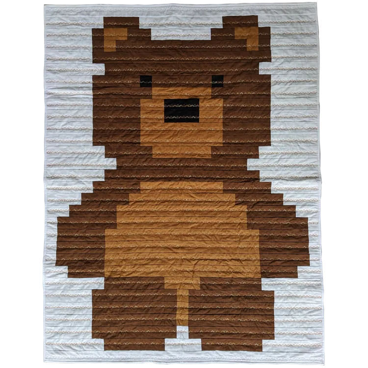 Children's quilt with teddy bear design in shades of brown on cotton
