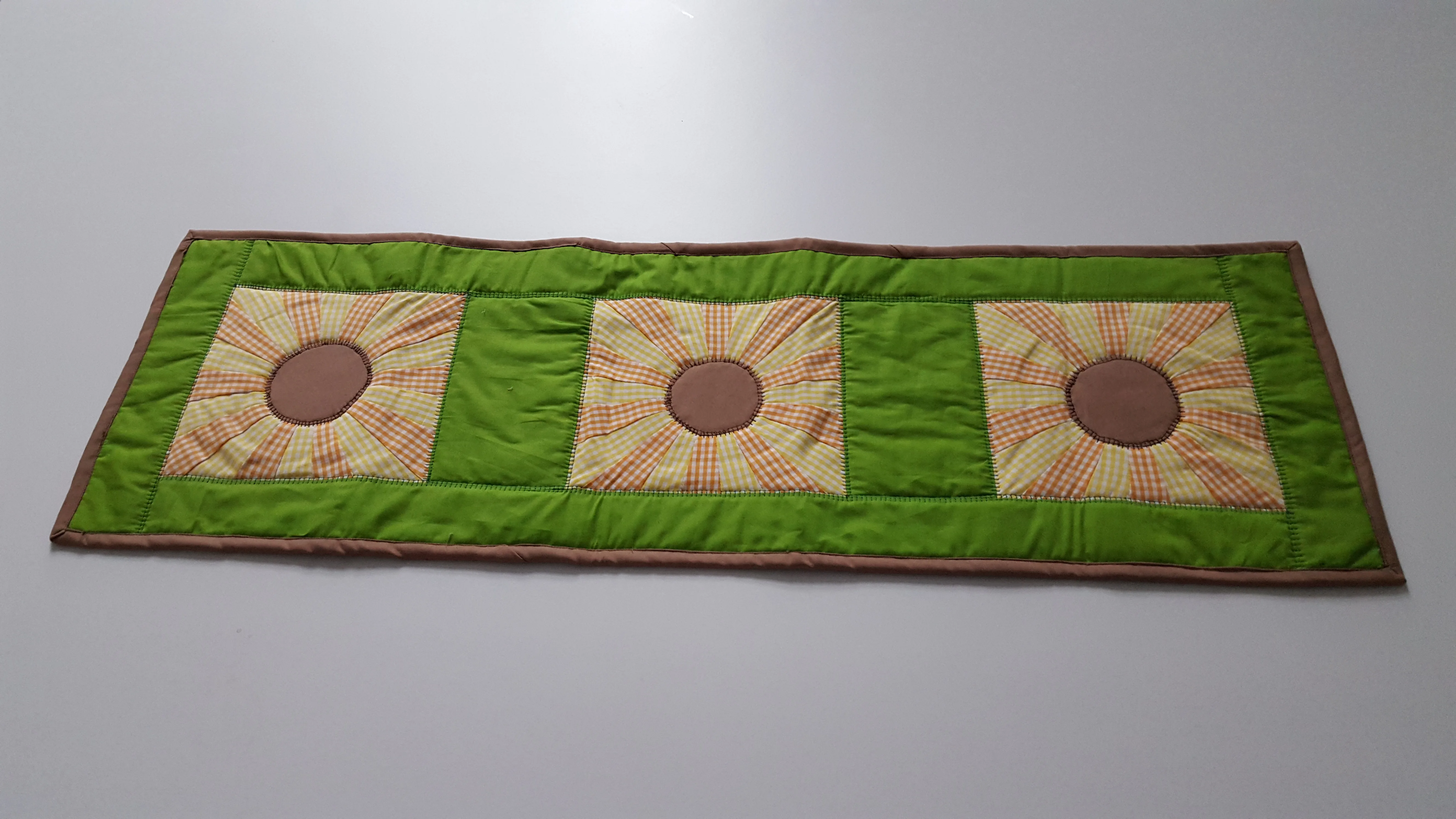 Table runner with sunflower design in green and brown on cotton